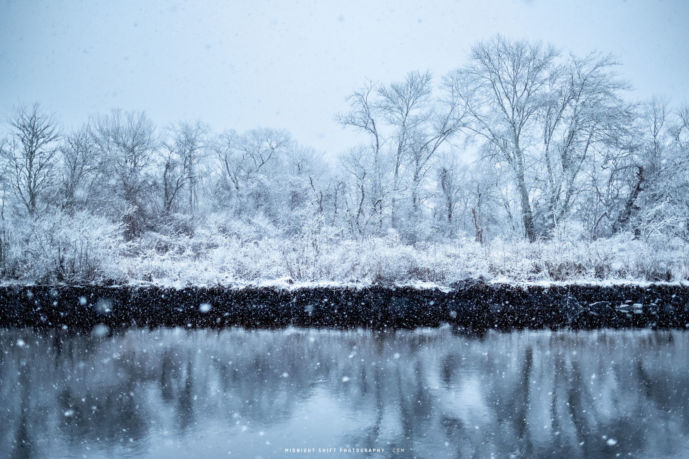 Snow falls over the head of the Westport river in Massachusetts