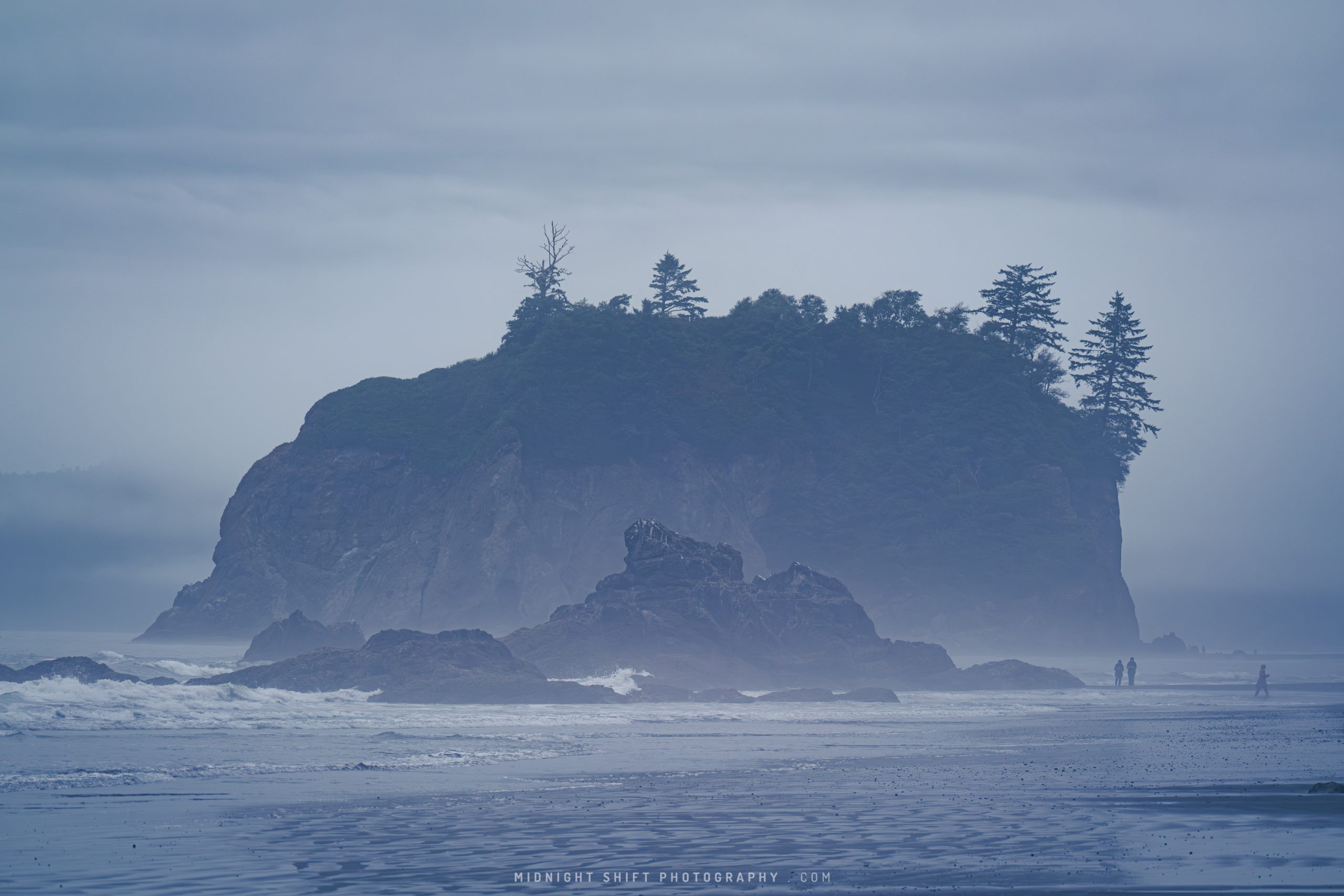 People walking in the fog on Ruby Beach, in Washington state
